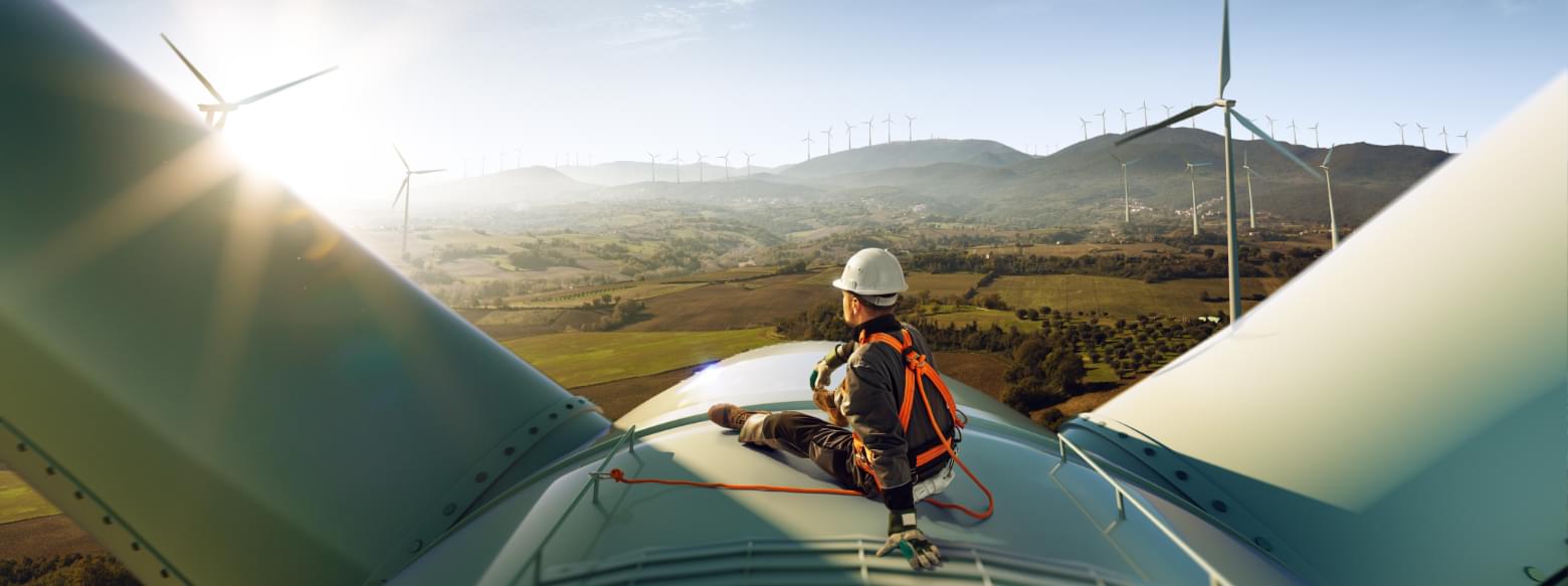 Man looking out from top of wind turbine